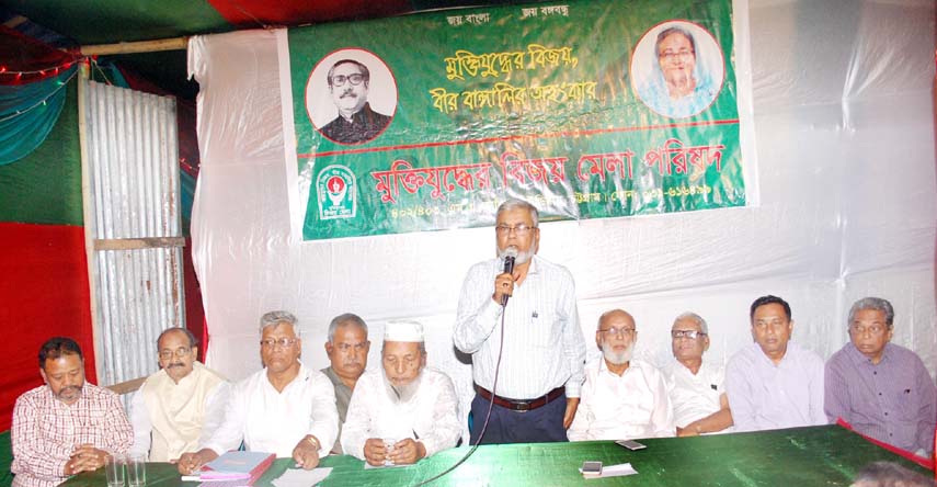 Commander M A Monsur Uddin speaking at a meeting of Muktijoddher Bijoy Mela Parishad at Port City.