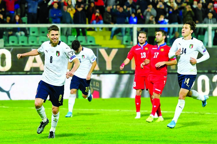 Italy's Jorginho ( left) celebrates after scoring his side's seventh goal during a Euro 2020 group J qualifying soccer match between Italy and Armenia at the Renzo Barbera stadium, in Palermo, Italy on Monday.