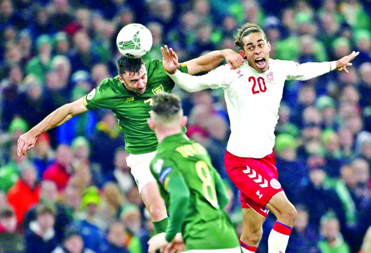 Denmark's Yussuf Poulsen (right) vies for the ball with Ireland's Edna Stevens (left) during the Euro 2020 group D qualifying soccer match between Ireland and Denmark at the Aviva stadium in Dublin, Ireland on Monday.
