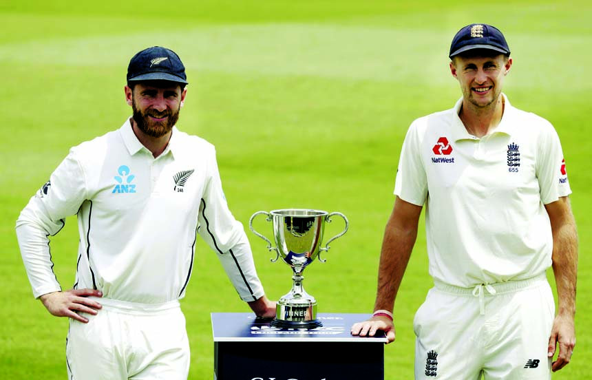 Rival captain's, New Zealand's Kane Williamson (left) and England's Joe Root pose for a photograph with a the series trophy ahead of the first cricket Test against England at Bay Oval in Mount Maunganui, New Zealand on Wednesday.