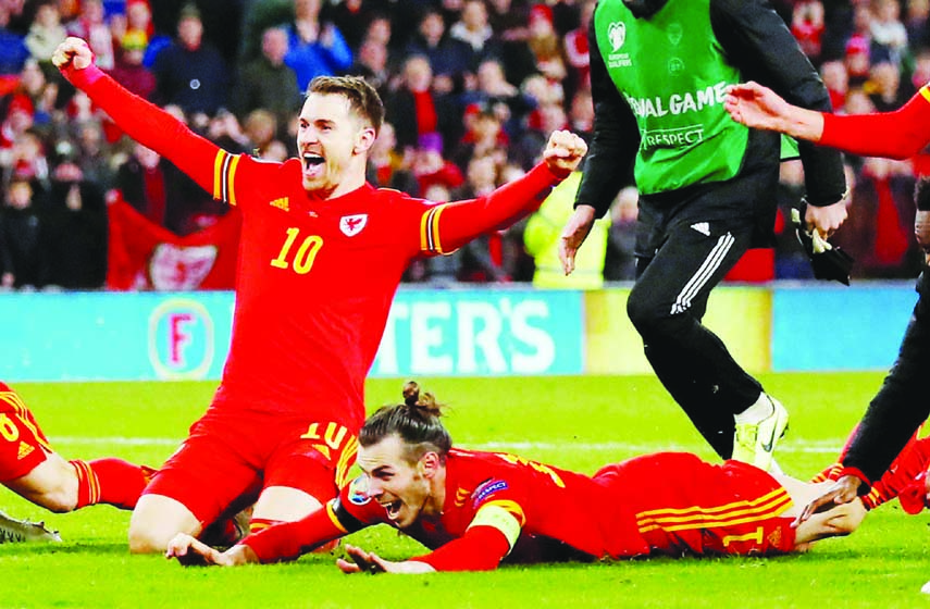 Wales' Aaron Ramsey (left) and Gareth Bale celebrate after the match against Hungary during the Euro 2020 Qualifier Group E at Cardiff City Stadium, Cardiff in Wales on Tuesday.