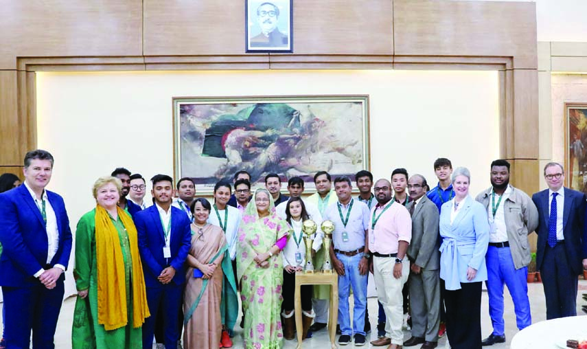 The players and the diplomats including winners of the participating countries in Sheikh Russel International Club Cup Tennis Tournament with Prime Minister Sheikh Hasina the Ganabhaban in the city on Wednesday. PID photo