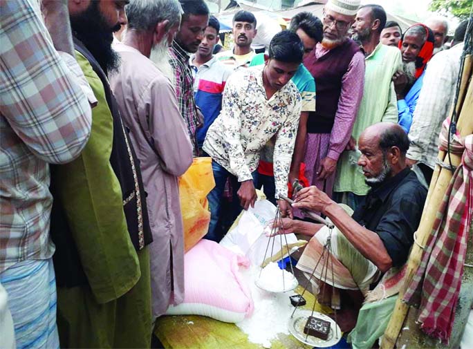 ULIPUR (Kurigram): People gathered for buying salt at a market in Ulipur Upazila due to remour of shortage of salt on Tuesday.