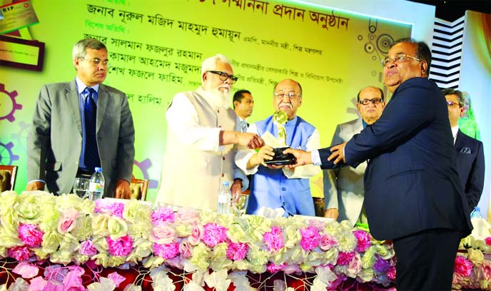 Md. Abdur Razzaq, founder Managing Director of JMI Group Limited, receiving the "CIP Award 2017" (Industry) for his outstanding and exceptional contribution to flourish the large Industry (Manufacturing) in the country from Industries Minister Nurul Maj