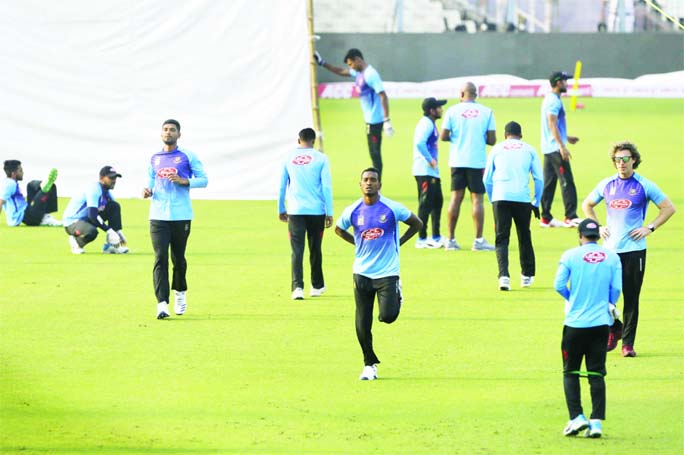 Bangladesh's Al-Amin Hossain (center) and others warm up during a practice session ahead of their second cricket Test match against India, in Kolkata, India on Thursday. The second and final game in the series is scheduled to be played in Kolkata startin
