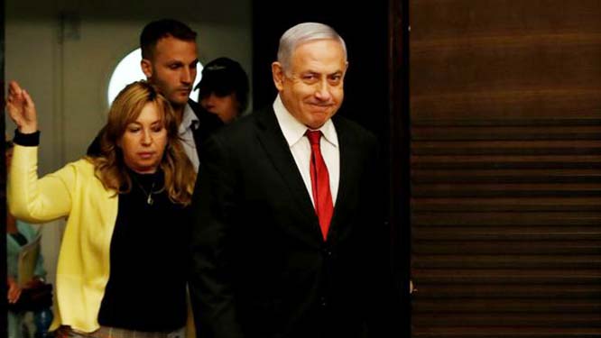 Supporters of Israeli Prime Minister Benjamin Netanyahu gather outside his residence in Jerusalem on Thursday.
