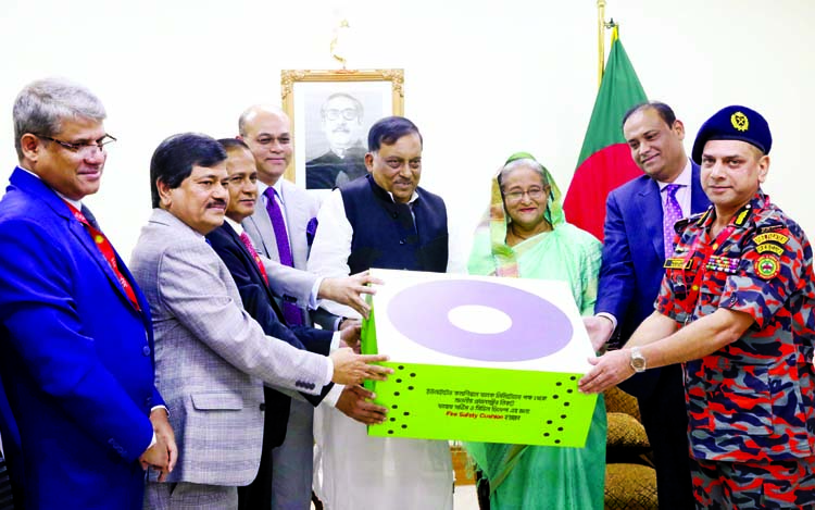 Prime Minister Sheikh Hasina handing over three ultra modern German made fire resistant jumbo cushions to Director General of the Fire Service and Civil Defence Department Brig Gen Md Sajjad Hossain at a function at the Prime Minister's Office yesterda
