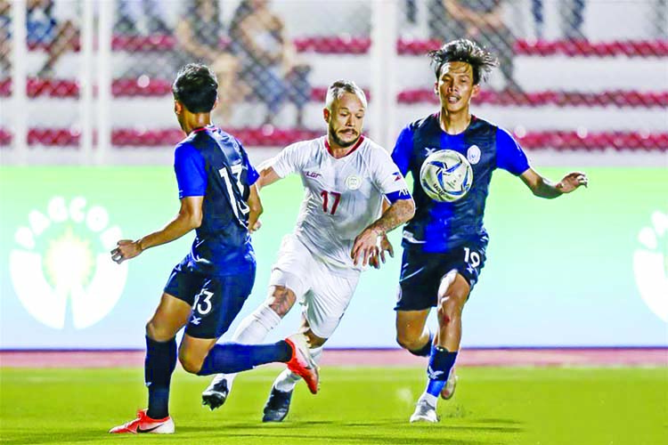 Stephan Schrock (center) of the Philippines in action during the men's first round football match against Cambodia at the SEA Games 2019 in Manila, Philippines on Monday.