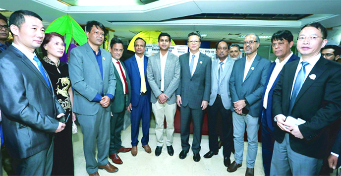 Li Jiming, Chinese Ambassador in Dhaka, poses for a photograph along with Yan, Minister Counselor of China after visiting Bangladesh China Chamber of Commerce & Industry (BCCCI) office in Dhaka on Tuesday. Gazi Golam Murtoza, President of the BCCCI and it