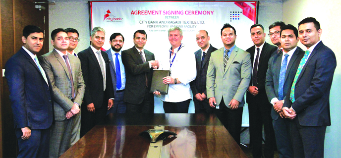 Luis Ramiro Garcia Insua, Managing Director of Ragadi Textile and Md. Abdul Wadud, DMD & Head of Commercial & Trade Business of City Bank, exchanging documents after signing agreement at the City Bank Centre at Gulshan in the city recently. Ragadi Textile