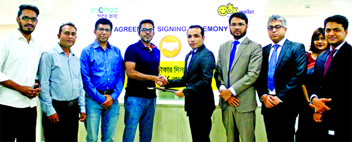Gazi Yar Mohammed, Head of MFS & Agent Banking of ONE Bank Ltd and Maksudul Islam, Chief Financial Officer of Shohoz Ltd, shaking hands after signing an agreement at the bank's head office in the city recently. Under the deal, customers will able to make