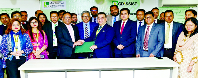 Syed Moinuddin Ahmed, Managing Director of GD Assist and Kazi Ahsan Khalil, DMD and Chief Business Officer of Modhumoti Bank, exchanging documents after signing an agreement at the bank's corporate office in the city recently. Bank's SEVP and COO Shahna