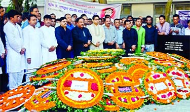 The memorial plaque of Shaheed Dr. Shamsul Alam Khan Milon bedecked with flowers placed by different organisations including Swechchhasebak League on the premises of Dhaka Medical College on Wednesday marking his martyrdom anniversary