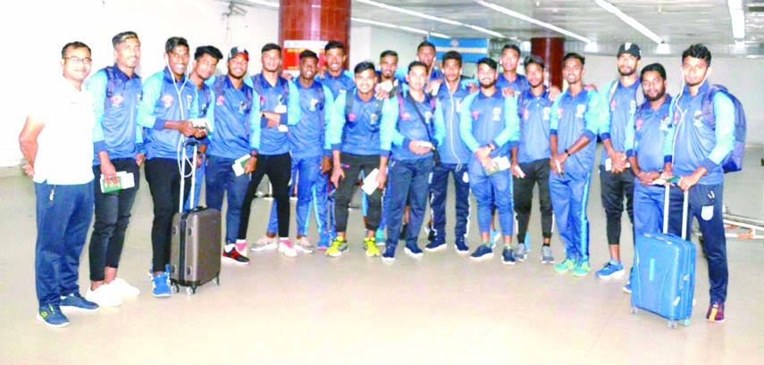 Members of Bangladesh Olympic football team pose for a photo session at the Hazrat Shahjalal International Airport before leaving for Nepal on Wednesday.