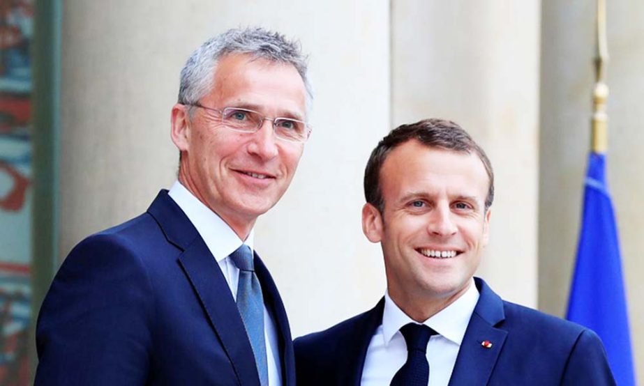 Emmanuel Macron greets Jens Stoltenberg before a meeting at the Elysee Palace in Paris, France.