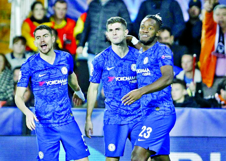Chelsea's players celebrate after scoring second goal during the Champions League Group H soccer match between Valencia and Chelsea at the Mestalla stadium in Valencia, Spain on Wednesday.