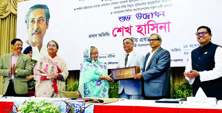 Prime Minister Sheikh Hasina receiving a replica of a ship after she inaugurated new five ships of Bangladesh Shipping Corporation through video conferencing at Ganobhaban on Thursday. BSS photo