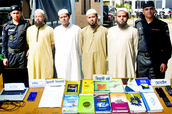 Members of Rapid Action Battalion in a drive arrested four suspected members of banned extremist outfit Jama'atul Mujahideen, Bangladesh from Feni Sadar on Thursday.