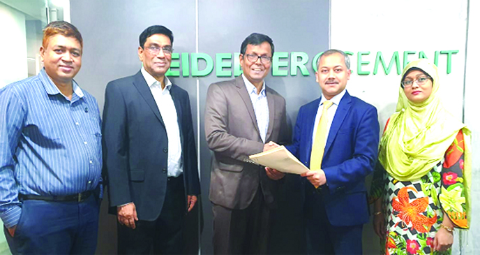 Jashim Uddin Chowdhury, CFO of HeidelbergCement Bangladesh Ltd. (HCBL) and and Shams Zaman, Director Corporate and Investment Banking of City Bank, exchanging documents after signing an agreement at the bank's head office in the city recently. Mustaque A