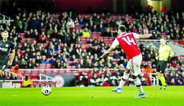 Arsenal's Pierre-Emerick Aubameyang scores the opening goal during the Europa League Group F soccer match between Arsenal and Eintracht Frankfurt at the Emirates Stadium, in London on Thursday.