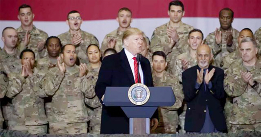 US President Donald Trump addresses troops at Bagram airbase outside Kabul, Afghanistan, on Thursday.