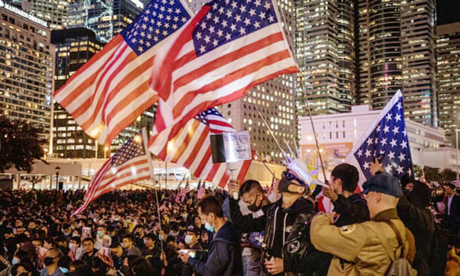 Pro-democracy protesters take part in a Thanksgiving Day rally on Thursday night in Hong Kong to say thank you to Donald Trump.