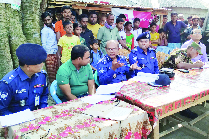 BHANGURA (Pabna) : Md Nisharul Arif, DIG, Rajshahi Police Range exchanging views with locals after visiting Koidanga Railway Bridge at Koidanga village in Bhangura Upazila on Thursday.