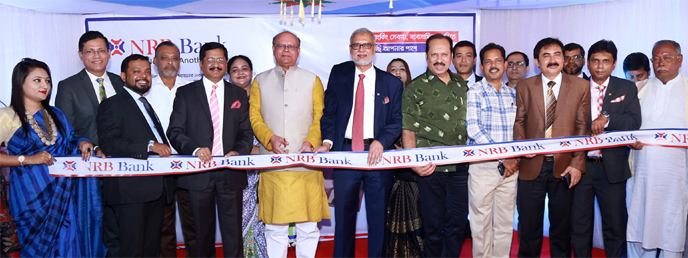 Swapan Bhattacharjee, State Minister for Local Government, Rural Development & Cooperatives, inaugurating the 46th branch of NRB Bank Limited at R.N. Road in Jashore recently. M Badiuzzaman, Chairman of the Executive Committee, Md. Mehmood Husain, Managi