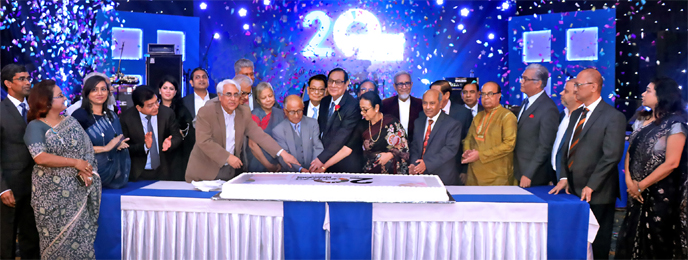 A. Rouf Chowdhury, Chairman of Bank Asia, inaugurating grand celebration in honor of its customers, beneficiaries and well-wishers on the occasion of the bank's 20th anniversary by cutting a cake at Radisson Blu in Dhaka recently. Former Chairmen M Syedu