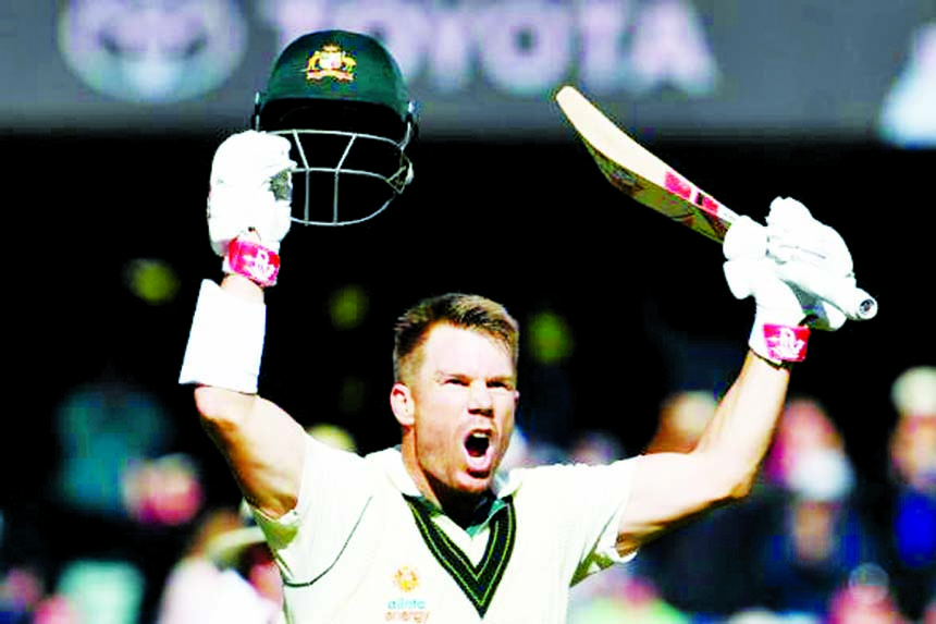 Australia's David Warner celebrates his triple century during the cricket Test match between Australia and Pakistan in Adelaide on Saturday.