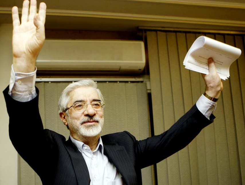 Photo shows Iranian reformist presidential candidate Mir Hossein Mousavi waving to the media during a late night press conference after polls closed in Tehran.