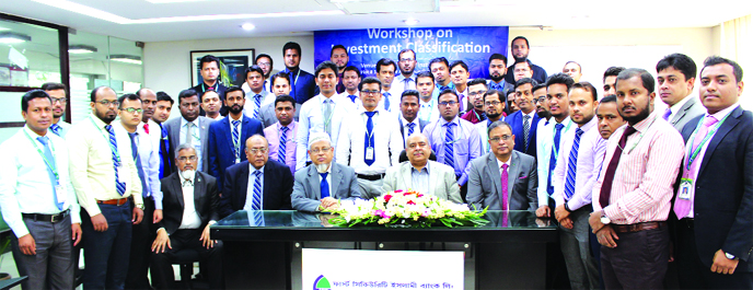 Syed Waseque Md Ali, Managing Director of First Security Islami Bank Limited, poses for photograph with the participants of a workshop on Investment Classification at the bank's training institute in the city on Saturday. Md. Ataur Rahman, Principal, Muh