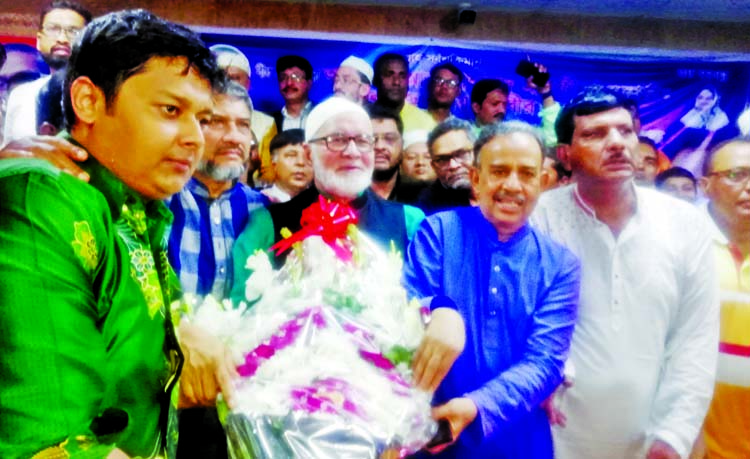 Newly elected President and General Secretary of Dhaka South Awami League Alhaj Abu Ahmed Mannafi and Humayun Kabir being greeted by the leaders and activists at AL city office yesterday.