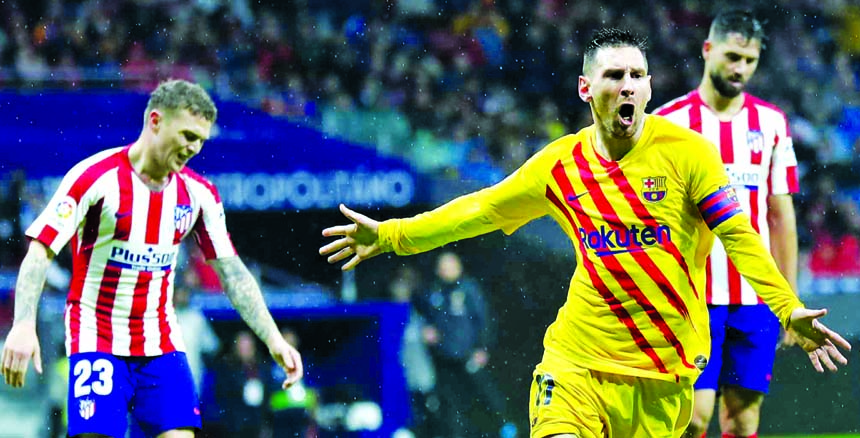 FC Barcelona's Lionel Messi celebrates after scoring his opening goal during a Spanish La Liga soccer match between Atletico Madrid and FC Barcelona at Wanda Metropolitano stadium in Madrid, Spain on Sunday.