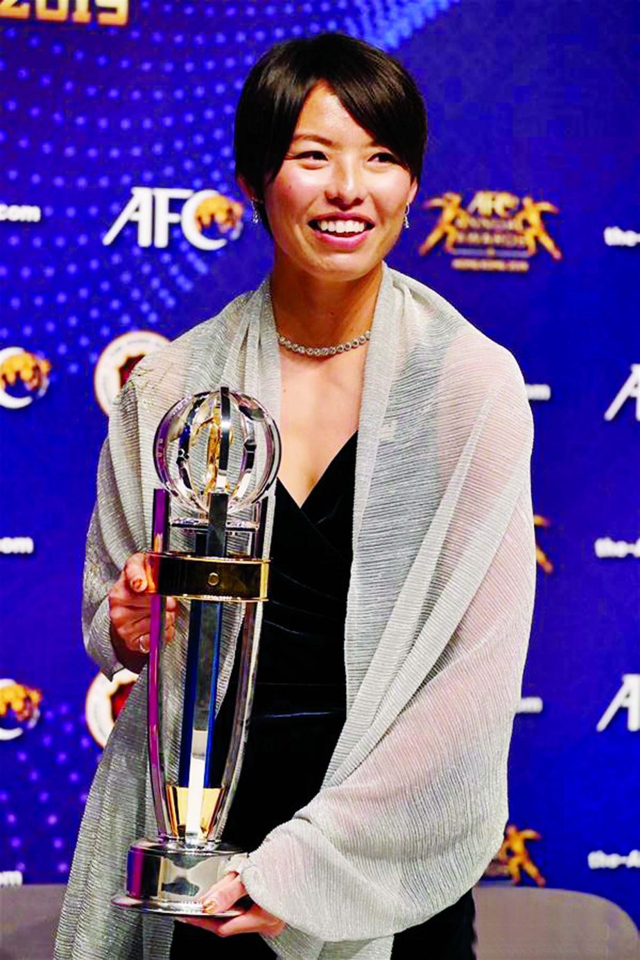 Saki Kumagai of Japan, receives a trophy after being named the AFC Women's Player of the Year during the Asian Football Confederation's Annual Awards ceremony in Hong Kong, South China on Monday.