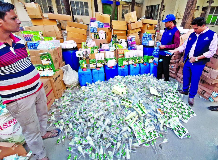 Seized counterfeit cosmetics being dumped at BSTI godown at Tejgaon in Dhaka before their grinding by authorities.