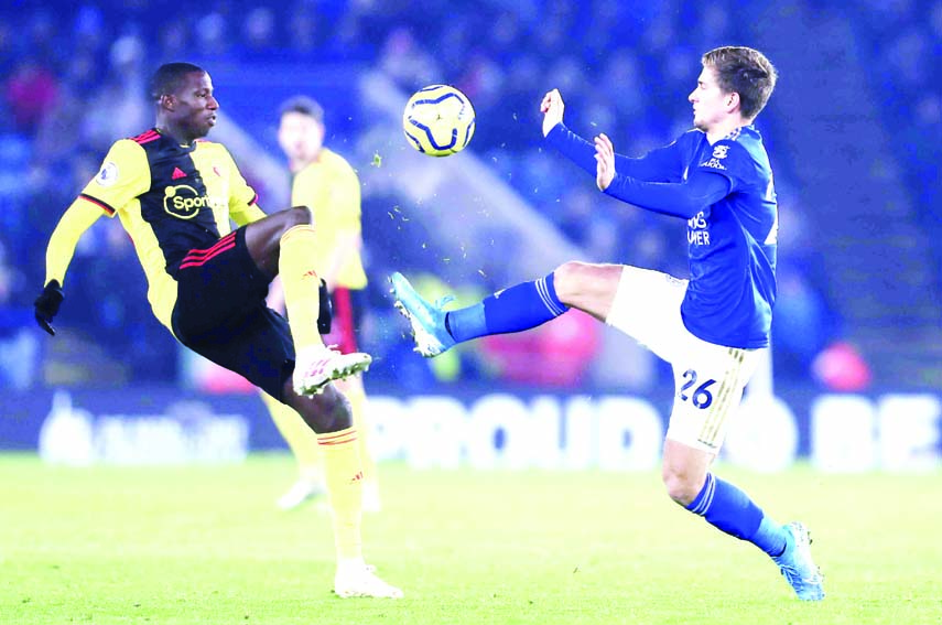 Watford's Abdoulaye Doucoure challenges for the ball against Leicester's Dennis Praet (right) during the English Premier League soccer match between Leicester City and Watford at the King Power Stadium in Leicester, England on Wednesday.