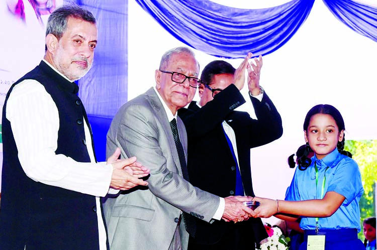 President M Abdul Hamid distributing tiffin boxes among the primary students of Raozan Upazila on the campus of Chattogram University of Engineering and Technology on Thursday as part of the ongoing mid-day meal programme of primary schools in Raozan upaz