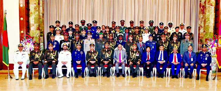 President Md. Abdul Hamid attended a photo session with the participants of National Defence Course (NDC) and Armed Forces War Course (AFWC) at Bangabhaban yesterday . BSS photo