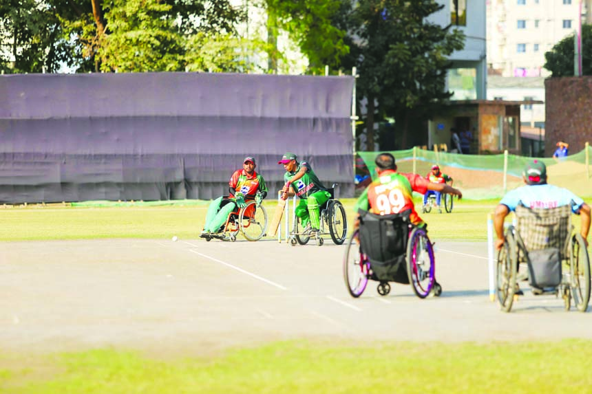 An action from the Twenty20 friendly match between Bangladesh national wheelchair (red) team and Bangladesh national wheelchair (green) team at University of Liberal Arts Bangladesh (ULAB) Ground in the city's Mohammadpur recently. ULAB arranged the exhi
