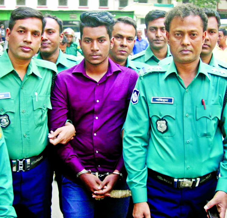 Police produce Abdur Rahman Saikat, before a Dhaka court on Sunday hours after he was taken on remand for alleged murder of Stamford University student Rubaiyat Sharmin Rumpa.