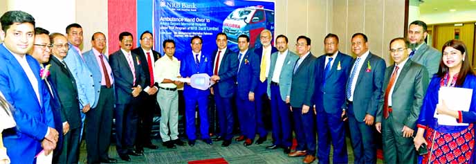 Mohammed Mahtabur Rahman, Chairman of NRB Bank Limited, handing over the key of an ambulance to the representatives of 'Amina Begum Memorial Hospital' in Aramnagar of Sarishabari in Jamalpur at the bank's head office in the city recently. Khandakar R A