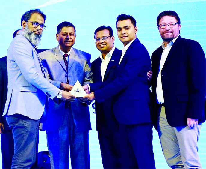 Abdul Alim Munshi, Executive Director (Business Transformation) of Akij Food & Beverage Limited, receiving the 'Best Brand Award-2019' in the carbonated soft drinks category organized by Brand Forum at La Meridian Hotel in the city on Saturday. Muntasir