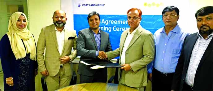 Mohammad Mobydur Rahman, Head of B2B, Partnership & Loyalty of Tonic (a digital healthcare service) and Md. Mizanur Rahman Mazumder, Managing Director of Port Land Group Limited, exchanging document after signing an agreement at Portland Sattar Tower in C