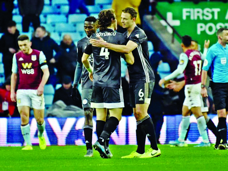 Leicester City players celebrate at the end of the English Premier League soccer match between Aston Villa and Leicester City at Villa Park in Birmingham, England on Sunday.