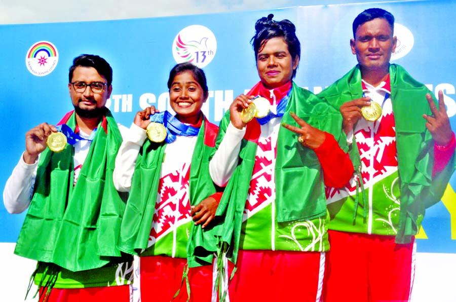 (From left to right) Ruman Sana, Eti Khatun, Suma Biswas and Sohel Rana, the four archers of Bangladesh showing gold medals of the Archery Competition of 13th South Asian Games at Pokhara in Nepal on Monday. BOA photo