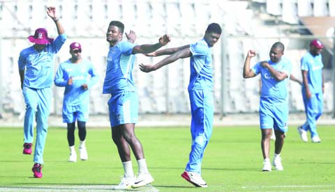 West Indies players warm up during a training session ahead of their third Twenty20 cricket match against India in Mumbai, India on Tuesday.