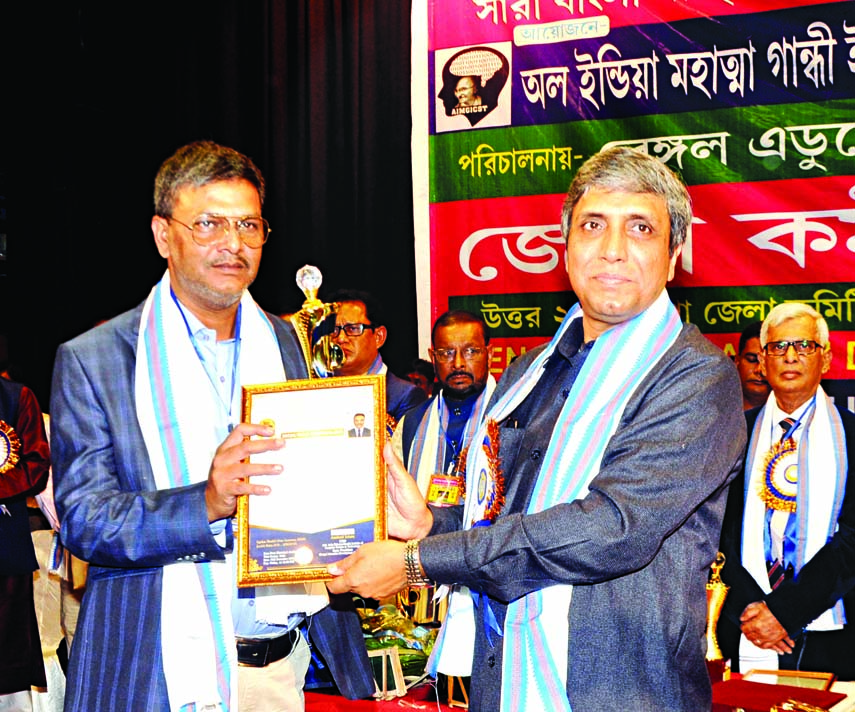 Vice-Chancellor of Maulana Abul Kalam Azad University of Technology, India Dr. Saikat Moitra handing over a citation crest to Advocate Shakil Ahmed of Bangladesh Supreme Court at a cultural function organised recently in Damdam Municipal auditorium of Pa