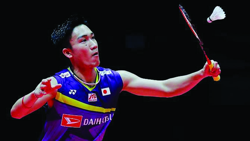 Japan's Kento Momota hits a return shot against Indonesia's Jonatan Christie during their men's singles semi-final badminton match at the World Tour Finals in Guangzhou in south China's Guangdong province on Friday.