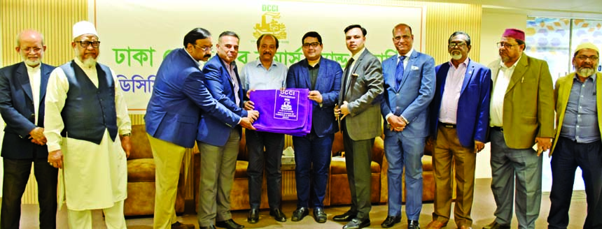 Osama Taseer, President of Dhaka Chamber of Commerce & Industry (DCCI), handing over warm clothsblankets to Suja Ur Rob Chowdhury, President of Dinajpur Chamber of Commerce & Industry for distributing among the distressed people of different parts of the